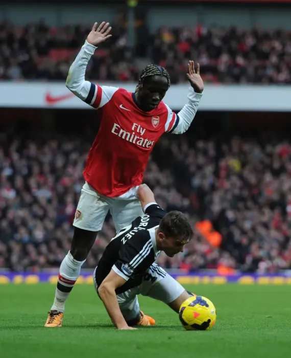 Framed Print : Arsenal vs Southampton: Bacary Sagna Clashes with Jay Rodriguez in Premier League Showdown