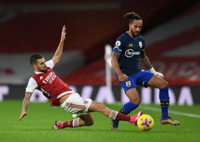 Framed Print : Arsenal vs Southampton: Ceballos Tackles Walcott in Intense Premier League Clash