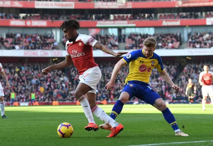Framed Print : Arsenal vs Southampton: Clash between Iwobi and Armstrong in the Premier League