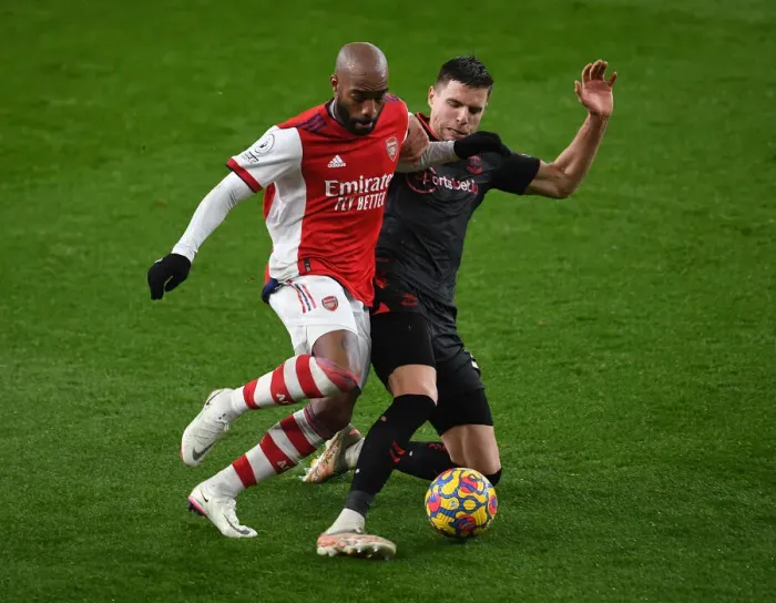 Framed Print : Arsenal vs. Southampton: Lacazette vs. Bednarek Clash in Premier League Showdown