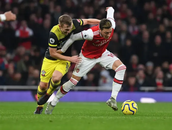Framed Print : Arsenal vs Southampton: Mesut Ozil Clashes with James Ward-Prowse in Premier League Showdown Framed Print : Arsenal vs Southampton: Mesut Ozil Clashes with James Ward-Prowse in Premier League Showdown