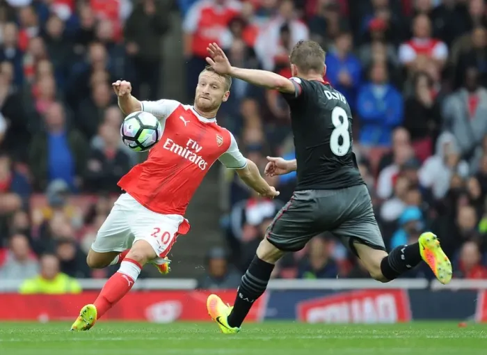 Framed Print : Arsenal vs Southampton: Mustafi Tackles Davis in Intense Premier League Showdown (2016-17)