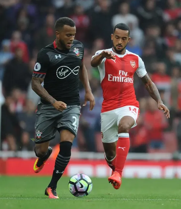 Framed Print : Arsenal vs Southampton: Walcott vs Bertrand - Premier League Battle at Emirates Stadium