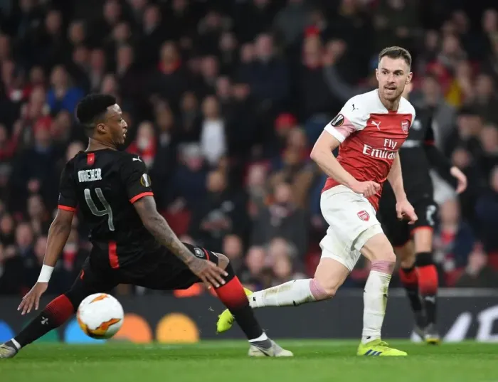 Framed Print : Arsenal vs Stade Rennais: Aaron Ramsey Clashes with Mexer in Europa League Showdown Framed Print : Arsenal vs Stade Rennais: Aaron Ramsey Clashes with Mexer in Europa League Showdown