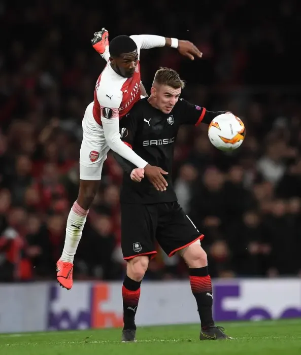 Framed Print : Arsenal vs. Stade Rennais: Ainsley Maitland-Niles and Benjamin Bourigeaud in Intense Europa League Clash Framed Print : Arsenal vs. Stade Rennais: Ainsley Maitland-Niles and Benjamin Bourigeaud in Intense Europa League Clash