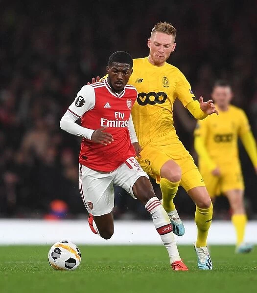 Arsenal vs Standard Liege: Ainsley Maitland-Niles Clashes with Renaud Emond in UEFA Europa League Match