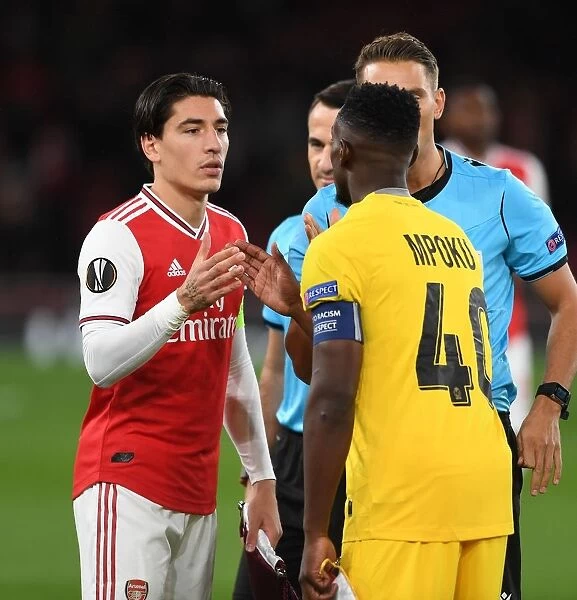 Arsenal vs Standard Liege: Hector Bellerin and Paul-Jose Mpoku Exchange Handshakes in Europa League Match (Arsenal FC 2019-20)