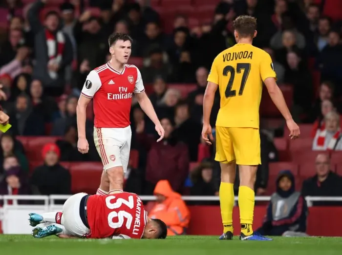 Framed Print : Arsenal vs Standard Liege: Tierney and Vojvoda Clash in Europa League Group F