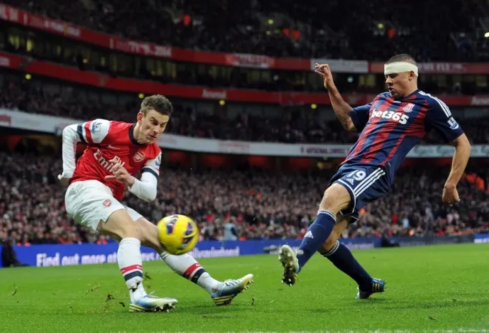 Framed Print : Arsenal vs Stoke City: Koscielny vs Walters - Premier League Tussle at Emirates Stadium