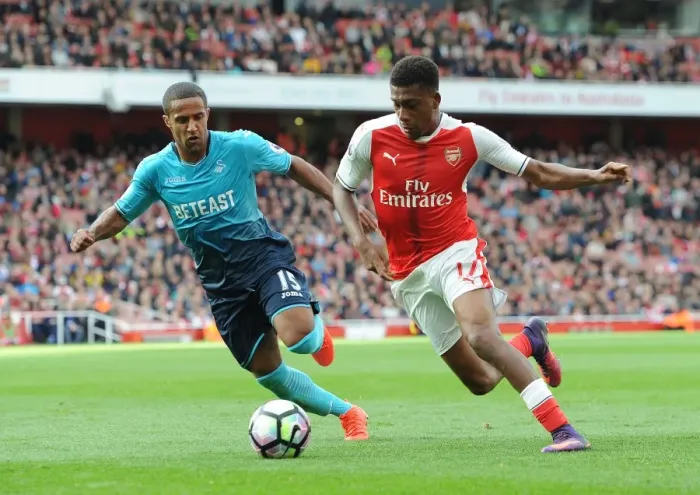 Framed Print : Arsenal vs Swansea City: Iwobi vs Routledge Clash in Premier League Battle (2016-17) Framed Print : Arsenal vs Swansea City: Iwobi vs Routledge Clash in Premier League Battle (2016-17)