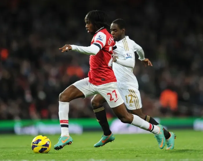 Framed Print : Arsenal vs Swansea: Gervinho vs Nathan Dyer Clash in the 2012-13 Premier League Framed Print : Arsenal vs Swansea: Gervinho vs Nathan Dyer Clash in the 2012-13 Premier League