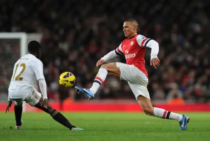 Framed Print : Arsenal vs Swansea: Kieran Gibbs vs Nathan Dyer Clash in Premier League Showdown (December 2012) Framed Print : Arsenal vs Swansea: Kieran Gibbs vs Nathan Dyer Clash in Premier League Showdown (December 2012)