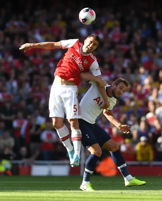 Framed Print : Arsenal vs. Tottenham: Sokratis Heads Off Harry Kane's Pressure in Intense Premier League Clash (2019-20)
