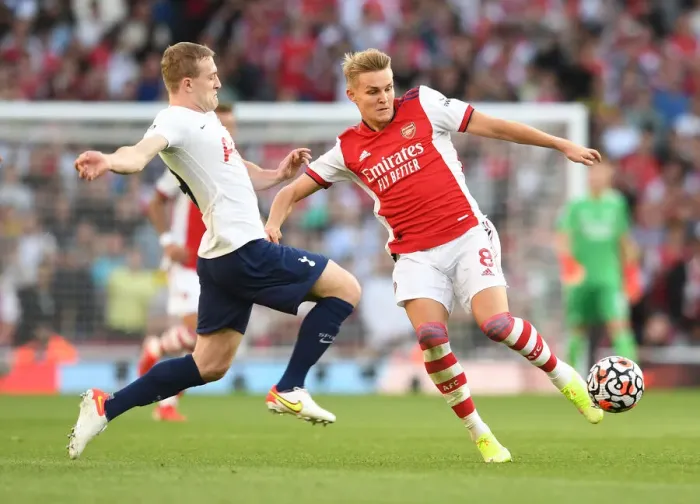 Framed Print : Arsenal vs. Tottenham: Intense Clash in the Premier League