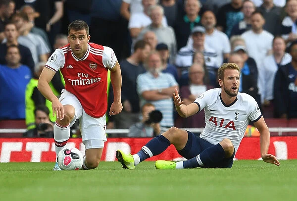 Arsenal vs. Tottenham: Intense Clash between Sokratis and Kane at the Emirates Stadium
