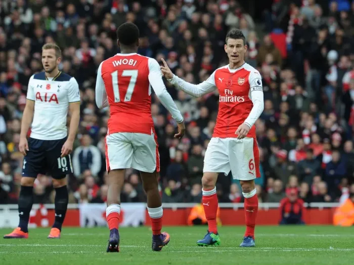 Framed Print : Arsenal vs. Tottenham: Koscielny Coaches Iwobi during Intense Premier League Clash (2016-17)