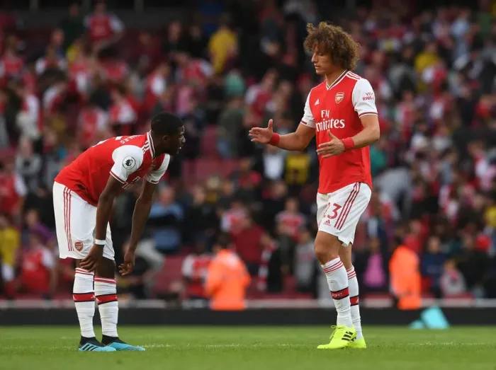 Framed Print : Arsenal vs. Tottenham: Luiz and Maitland-Niles Share a Moment After Intense Rivalry Framed Print : Arsenal vs. Tottenham: Luiz and Maitland-Niles Share a Moment After Intense Rivalry