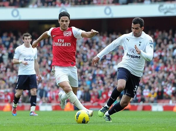 Arsenal vs. Tottenham: Mikel Arteta Faces Off Against Sandro in the Intense 2011-12 Premier League Clash