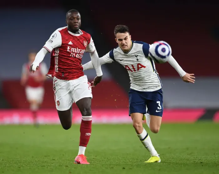 Framed Print : Arsenal vs. Tottenham: Pepe vs. Reguilon Battle in the Premier League