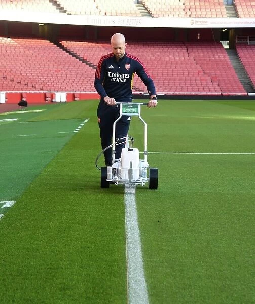 Arsenal vs. Tottenham: Preparing the Battlefield - Arsenal FC's Groundsman Marks the Emirates Stadium Pitch