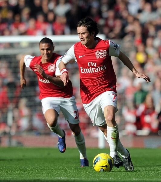 Arsenal vs. Tottenham: Rosicky and Gibbs in Action during the Intense 2011-12 Premier League Clash
