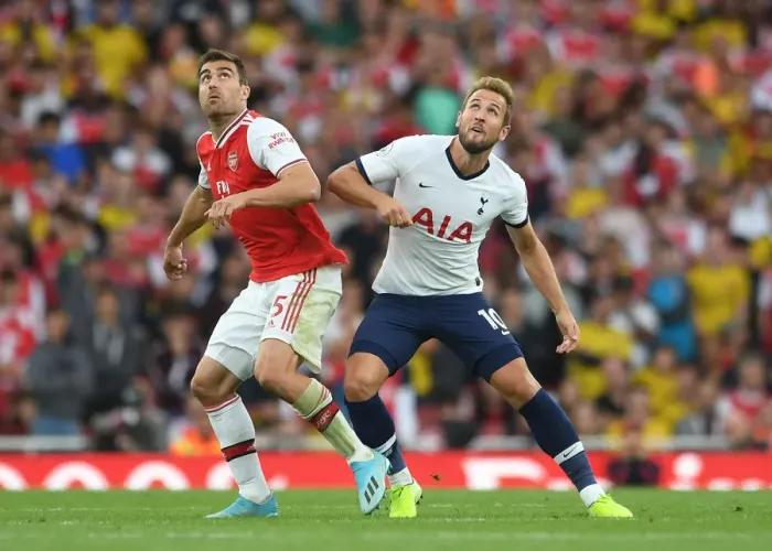 Framed Print : Arsenal vs. Tottenham: Sokratis Challenges Kane in Intense Premier League Clash (2019-20)