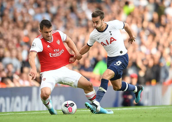 Arsenal vs. Tottenham: Sokratis Clashes with Harry Winks in the 2019-20 Premier League Showdown