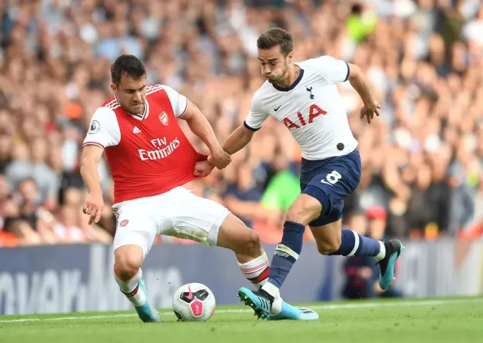 Framed Print : Arsenal vs. Tottenham: Sokratis Clashes with Harry Winks in the 2019-20 Premier League Showdown Framed Print : Arsenal vs. Tottenham: Sokratis Clashes with Harry Winks in the 2019-20 Premier League Showdown
