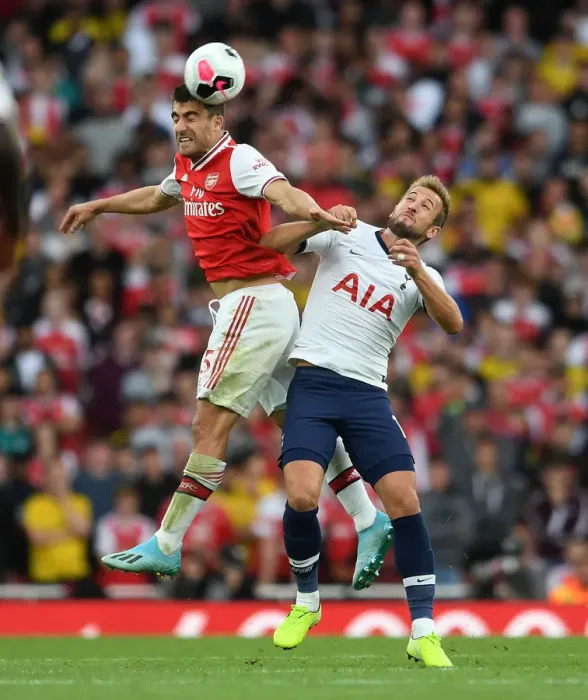Framed Print : Arsenal vs. Tottenham: Sokratis and Kane Clash in Intense Premier League Showdown