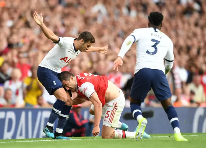Framed Print : Arsenal vs. Tottenham: Sokratis vs. Winks in Intense Premier League Clash Framed Print : Arsenal vs. Tottenham: Sokratis vs. Winks in Intense Premier League Clash