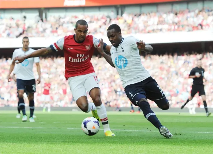 Framed Print : Arsenal vs. Tottenham: Theo Walcott vs. Danny Rose - Intense Battle in the 2013-14 Premier League