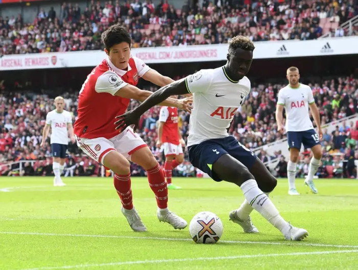 Framed Print : Arsenal vs. Tottenham: Tomiyasu Shuts Down Sanchez in Intense Premier League Clash (2022-23)