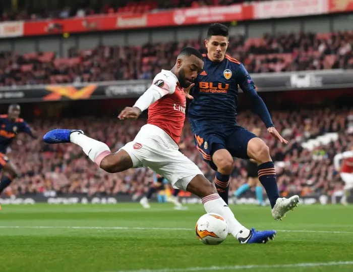 Framed Print : Arsenal vs Valencia: Alex Lacazette Faces Off Against Facundo Roncaglia in the 2018-19 Europa League Semi-Final First Leg Framed Print : Arsenal vs Valencia: Alex Lacazette Faces Off Against Facundo Roncaglia in the 2018-19 Europa League Semi-Final First Leg