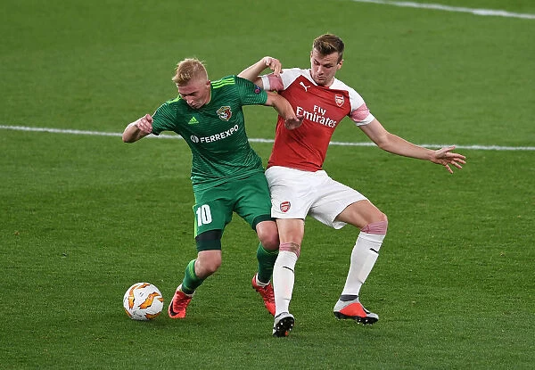 Arsenal vs Vorskla Poltava: Rob Holding Tackles Vladyslav Kulach in Europa League Clash