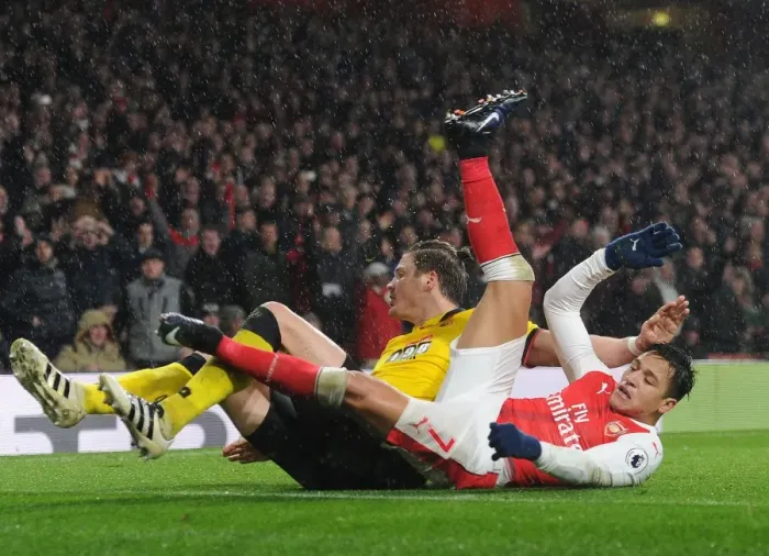 Framed Print : Arsenal vs. Watford: Alexis Sanchez Fouled by Sebastian Prodl during Premier League Clash Framed Print : Arsenal vs. Watford: Alexis Sanchez Fouled by Sebastian Prodl during Premier League Clash