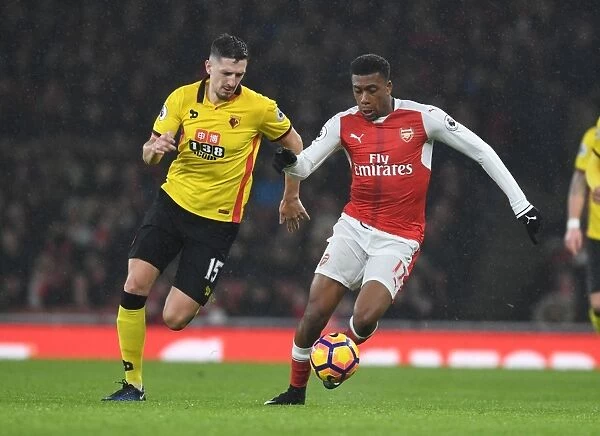 Arsenal vs. Watford: Intense Battle Between Iwobi and Cathcart in the Premier League