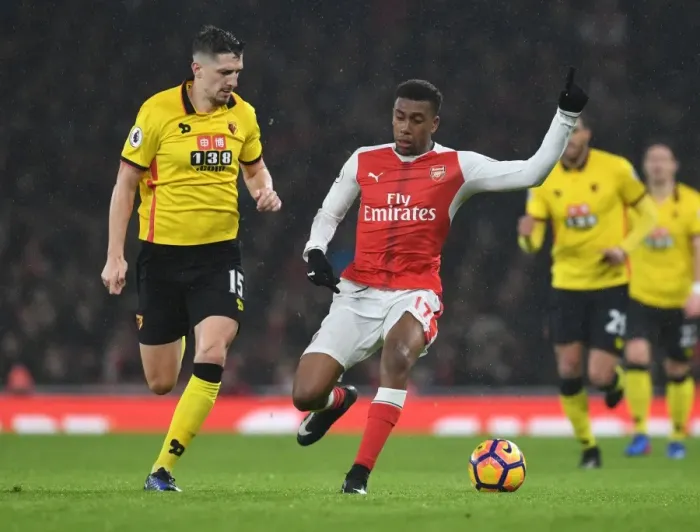 Framed Print : Arsenal vs. Watford: Intense Clash Between Iwobi and Cathcart in Premier League Match