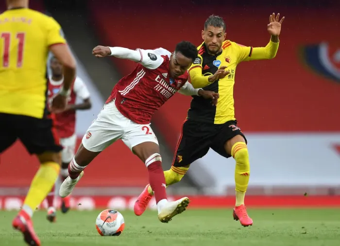 Framed Print : Arsenal vs. Watford: Joe Willock Clashes with Roberto Pereyra in Premier League Showdown