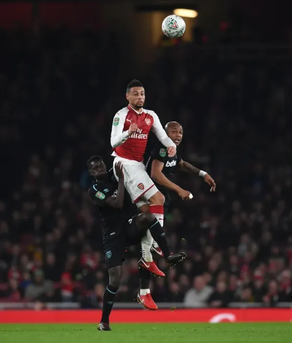 Framed Print : Arsenal vs. West Ham: Coquelin Faces Off Against Ayew and Quina in Carabao Cup Showdown