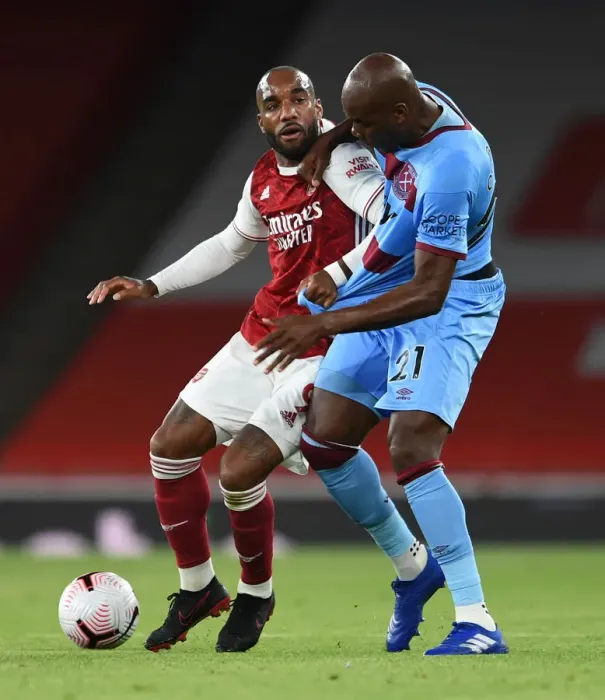 Framed Print : Arsenal vs. West Ham: Lacazette vs. Ogbonna in Intense Battle at Emirates Stadium Framed Print : Arsenal vs. West Ham: Lacazette vs. Ogbonna in Intense Battle at Emirates Stadium