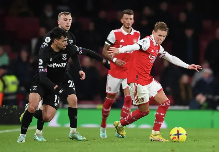 Framed Print : Arsenal vs. West Ham: Martin Odegaard Clashes with Lucas Paqueta in Premier League Showdown (December 2022)