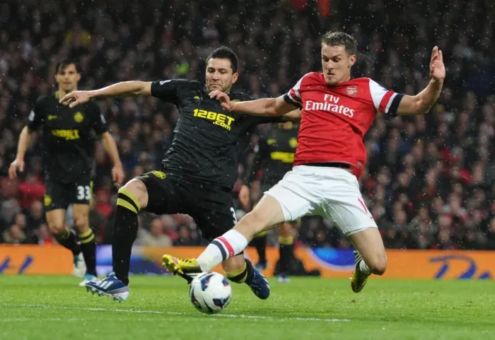 Framed Print : Arsenal vs. Wigan Athletic: Ramsey vs. Alcaraz Clash in Premier League Showdown