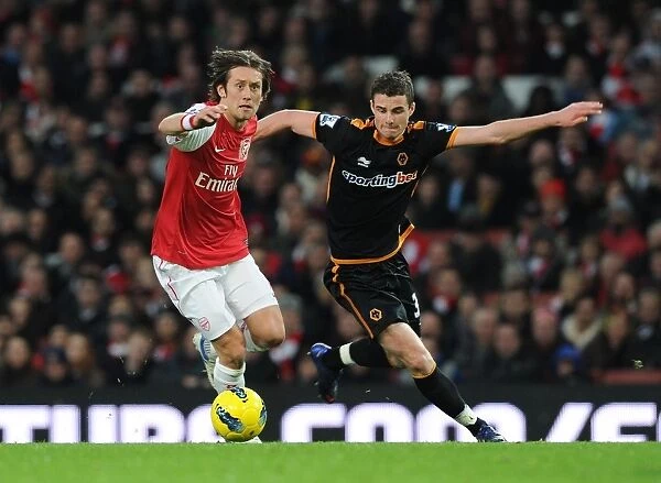 Arsenal vs. Wolverhampton Wanderers: Rosicky vs. Forde Clash in the Premier League (2011-2012)