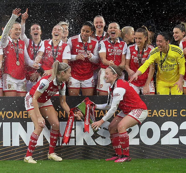 Arsenal Women Celebrate FA WSL Cup Triumph: Leah Williamson and Kim Little Lift the Trophy