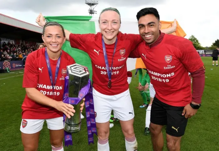 Framed Print : Arsenal Women Celebrate Historic WSL Title Win with Katrine Veje, Ava Kuyken, and Team Physio Eoin Clarkin: Holding the Trophy High at Meadow Park