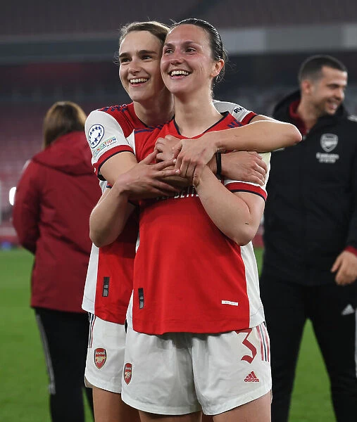 Arsenal Women Celebrate Quarterfinal Victory Over VfL Wolfsburg: Miedema and Wubben-Moy Embrace in Jubilation