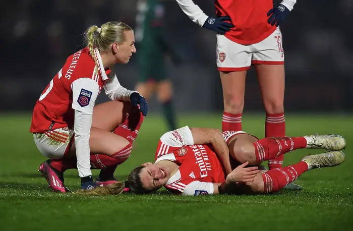 Framed Print : Arsenal Women: A Heartwarming Moment of Care and Solidarity on the Field - Arsenal vs Liverpool (2022-23)