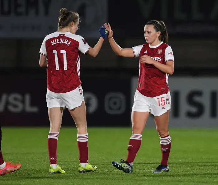 Framed Print : Arsenal Women Triumph Over Manchester United: Miedema and McCabe Celebrate FA WSL Victory Amidst Empty Stands