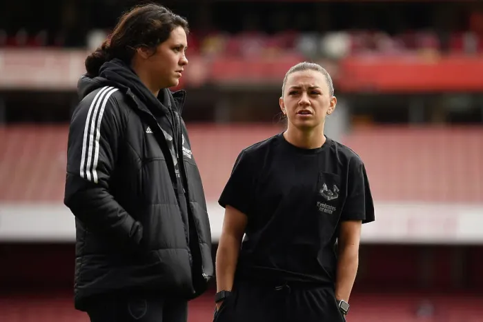 Framed Print : Arsenal Women: Unity Before Battle - McCabe and Marckese's Pre-Match Moment at Emirates Stadium