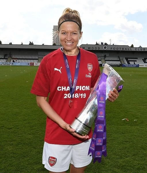 Arsenal Women's Historic WSL Title Win: Janni Arnth Celebrates with the Trophy